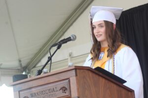 Doug Flanagan/Post-Record 
 Washougal High School valedictorian Claire Zakovics speaks during the school's Class of 2024 graduation ceremony on June 8, 2024, at Fishback Stadium.