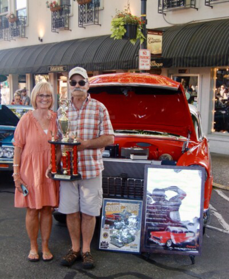 Kelly Moyer/Post-Record files 
 Visitors inspect classic cars at the Camas Car Show in downtown Camas, June 29, 2019., Kelly Moyer/Post-Record files, Visitors inspect classic cars at the Camas Car Show in downtown Camas, June 29, 2019.