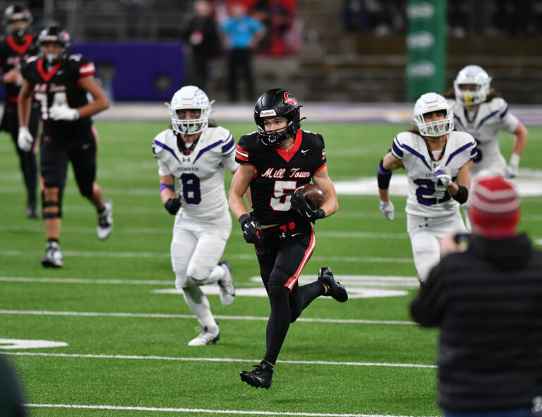 Camas senior Chase McGee (5) sprints for a touchdown Saturday, Dec. 7, 2024, during the Papermakers’ 27-24 loss to Sumner in the 4A State Championship game at Husky Stadium.