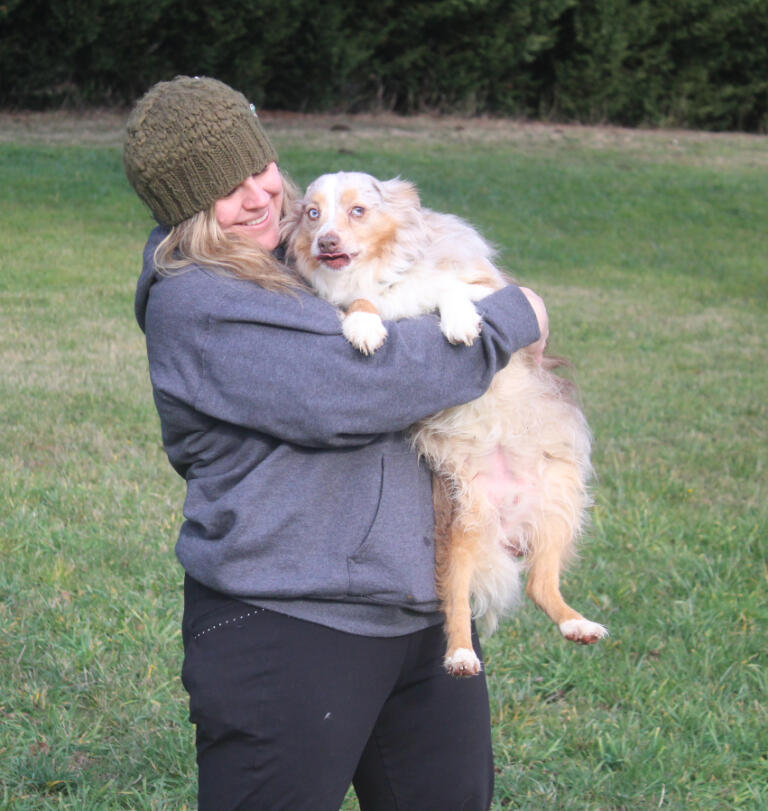 Jess Kristen Peterson, the owner of Fuzzy Butt Pet Photography, plays with her dog, Pippin, at her rural Washougal property on Dec. 16, 2024.