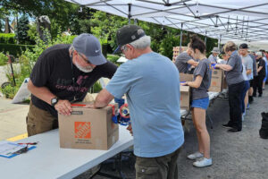 IMPACT Washougal volunteers package food donations in 2024. IMPACT Washougal is one of several Camas-Washougal Community Chest grant recipients serving local residents in need. (Contributed photo courtesy of Rich Reiter)