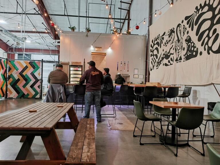 Patrons talk and drink beer at Recluse Brew Works in Washougal on Saturday, Jan. 11, 2025.