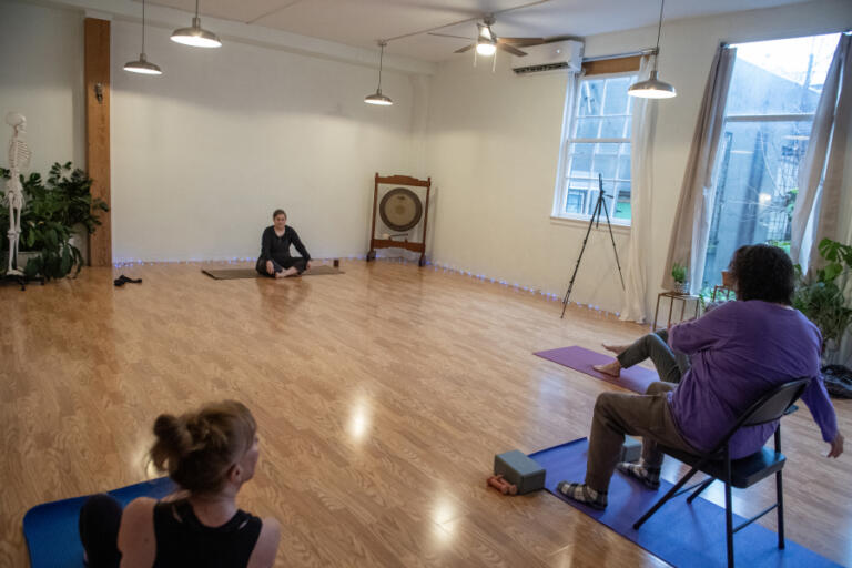 Jacquie Hill leads a fitness class at LiveWell Camas as participants have the option to sit in a chair for their exercises on Friday morning, Jan. 10, 2025.