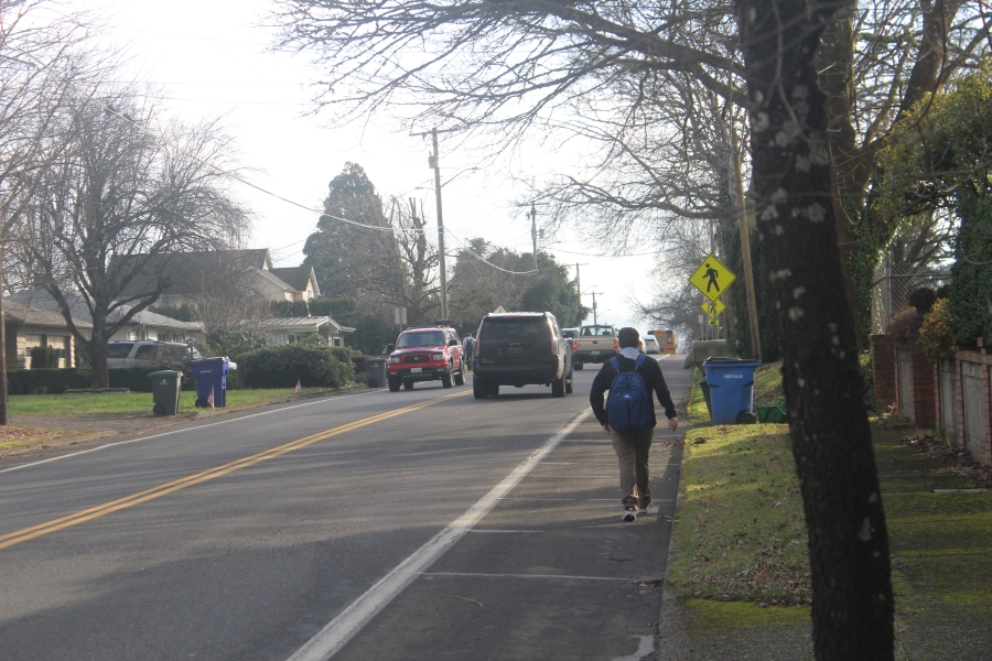 A Washougal High School student walks south along the shoulder of 39th Street in Washougal on Friday, Jan. 17, 2025.