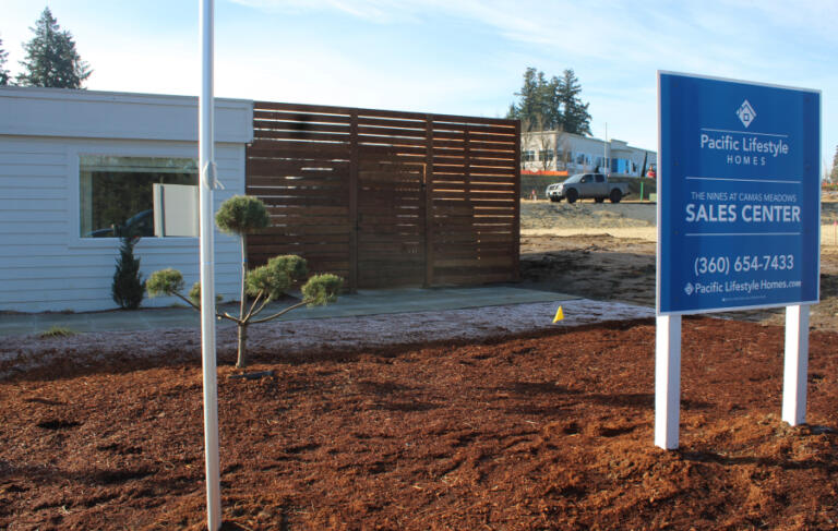 A sign directs visitors to Pacific Lifestyle Homes&rsquo; sales center at The Nines at Camas Meadows, Jan.