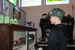 Contributed photo courtesy of Washougal School District 
 A Gause Elementary School student explores a houseware item collection at Two Rivers Museum on Jan. 28, 2025.