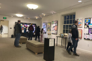 Visitors to the Second Story Gallery in downtown Camas browse elementary students' artwork during the gallery's 2024 