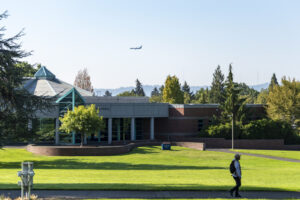 A plane flies above the Clark College campus Sept. 19, 2022, during the first day of classes. (Taylor Balkom/The Columbian files)