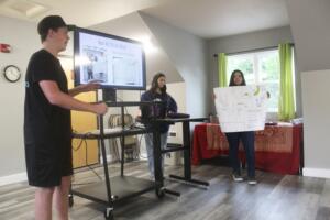 Washougal High School students Hunter Hardin, left, Olivia Alvarez, center, and Joselyn Guajardo speak during a Unite! Washougal meeting held Aug. 22, 2024 at the East County Family Resource Center in Washougal. (Doug Flanagan/Post-Record files)