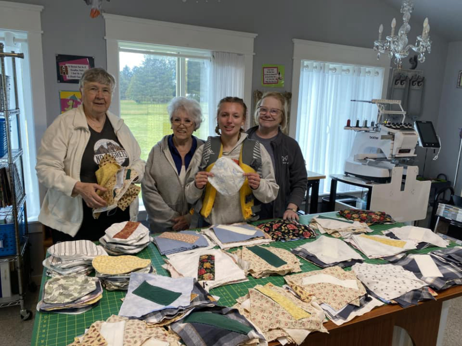 Buggy Eakin, a member of the Washougal Girl Scout Troop 45703, second from right, asked friends and other Girl Scouts to help her make 1,000 reusable menstrual pads for women and girls in Uganda. The group began the project in the spring of 2023 and finished in September 2024. (Photos contributed by Buggy Eakin)