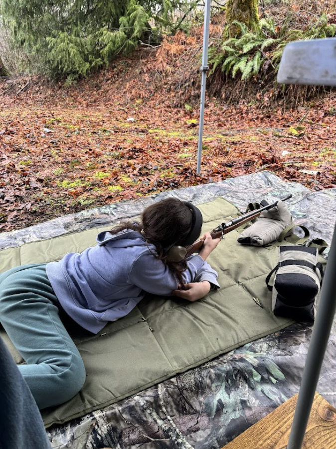 Washougal resident Lilliana Lavasseur, 10, handles a gun on Feb.