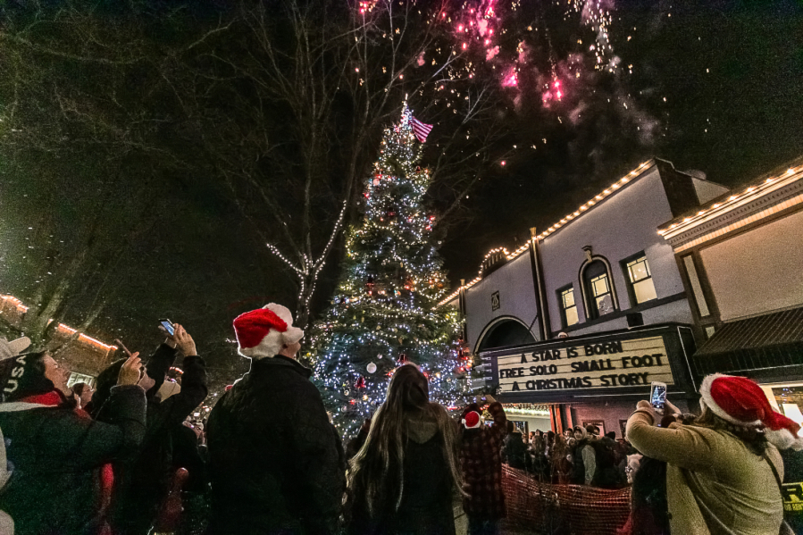 People gathered for the city of Camas’ annual Hometown Holidays celebration watch fireworks explode over the Liberty Theatre in downtown Camas on Dec. 7, 2018. (Post-Record files)