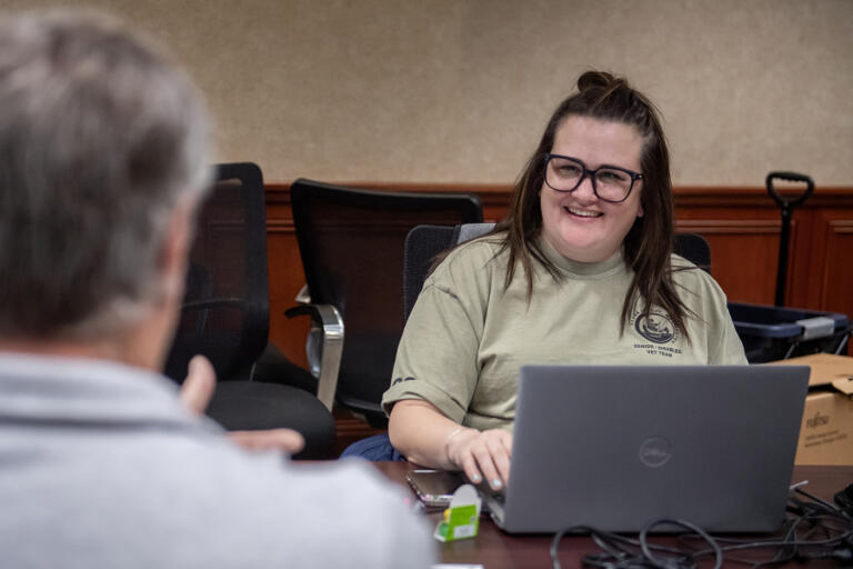 Staffer Danielle Scott works with older adults during Clark County&rsquo;s property tax exemption program event at Camas City Hall on Friday afternoon.