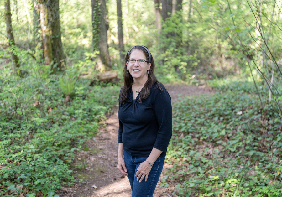 Krista Bashaw, here at Falling Leaf Lake Park, is retiring after a 30-year career organizing special events for the Camas Parks and Recreation Department. (Taylor Balkom/The Columbian)