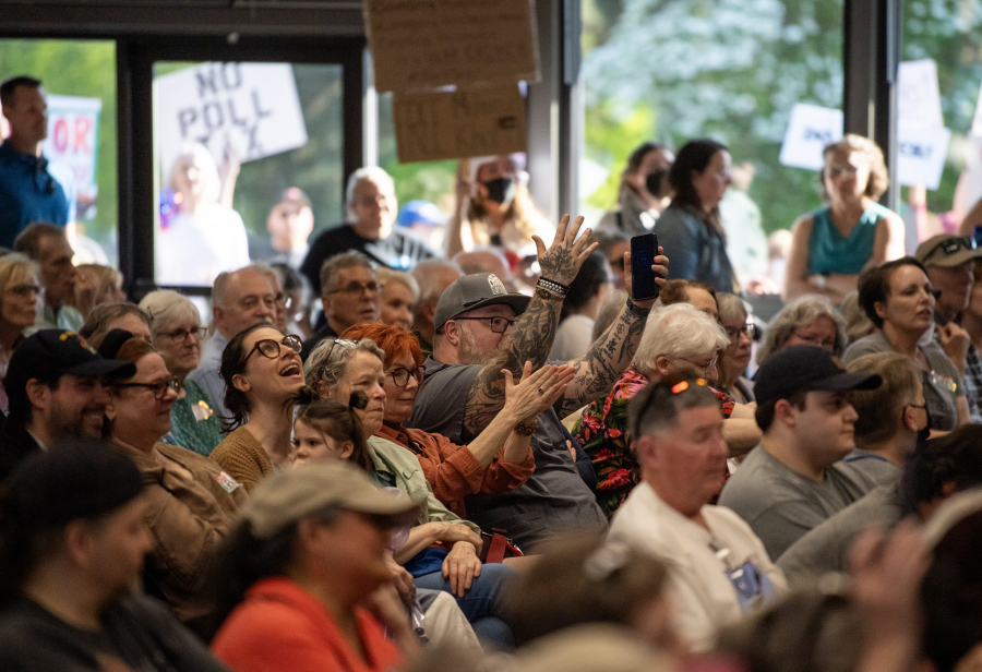 Audience members react Thursday during a town hall with U.S. Rep. Marie Gluesenkamp Perez, D-Skamania, at the Luepke Center in central Vancouver. (Taylor Balkom/The Columbian)