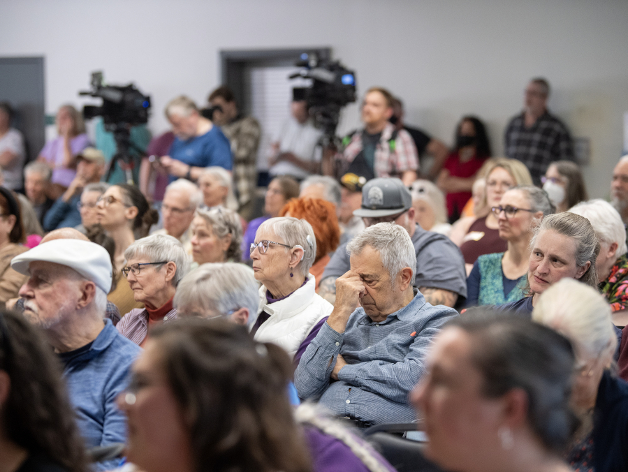 Audience members listen to U.S. Rep. Marie Gluesenkamp Perez, D-Skamania, answer questions Thursday during a town hall at the Luepke Center in central Vancouver. Hundreds of constituents lined up for the event with signs expressing their anger over Perez’s voting record. (Photos by Taylor Balkom/The Columbian)