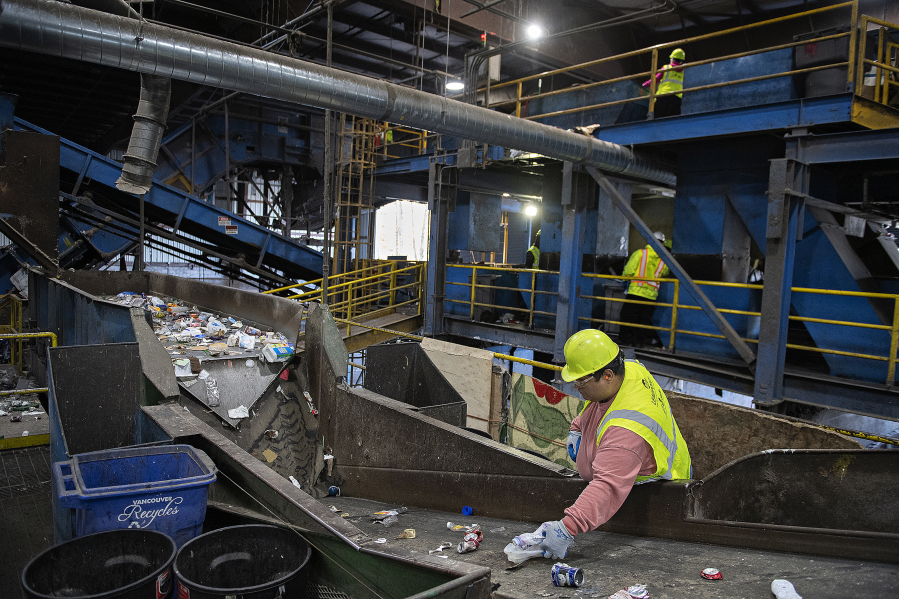 Different types of recycling are sorted as crews work at West Van Material Recovery Center on Nov. 13, 2023. Senate Bill 5284, passed by the Washington Legislature this session, creates a statewide plan for recycling. (Amanda Cowan/The Columbian files)
