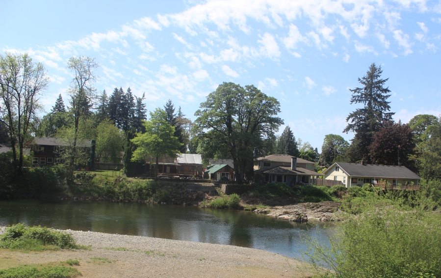 Houses near the Washougal River are viewed from Washougal’s Sandy Swimming Hole park on Friday, May 2, 2025. (Doug Flanagan/Post-Record)