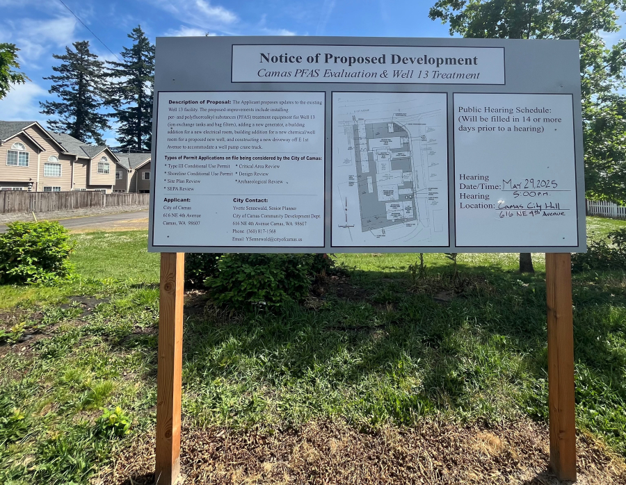 A notice of proposed development sign stands on the city of Camas’ Well 13 property off Southeast Cramer Lane on Thursday, May 8, 2025. A Camas hearings examiner will oversee a public hearing at 5 p.m. May 29 at Camas City Hall to consider the city’s plan to build a treatment facility on the Well 13 site to remove toxic PFAS, known as “forever chemicals,” from the public drinking water well. (Kelly Moyer/The Columbian)