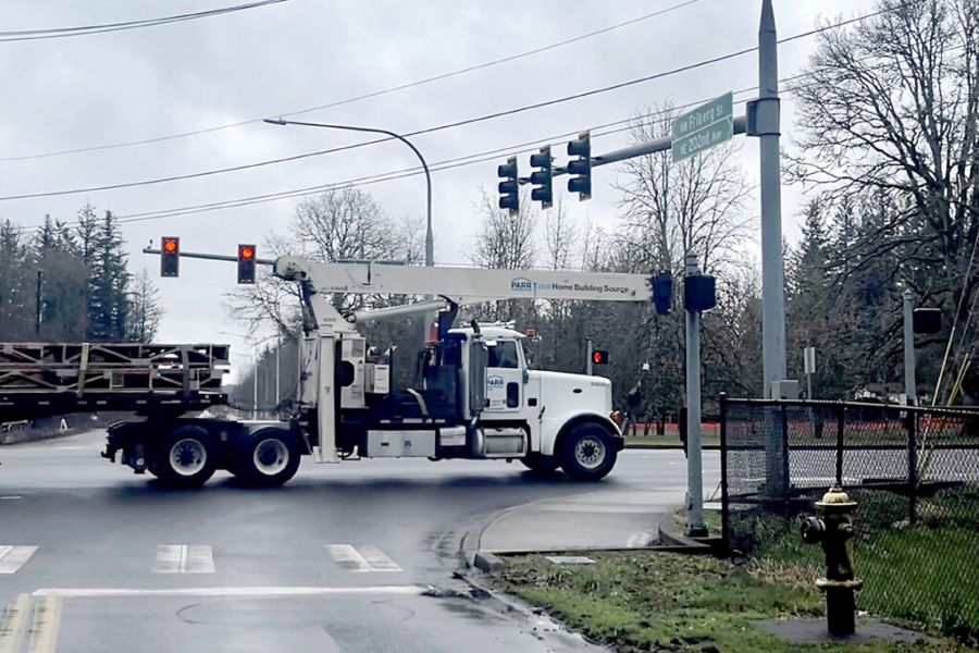 A truck drives through the intersection of Northeast 13th and Northwest Friberg-Strunk streets in Camas near the site of a proposed gas station development on March 4, 2024. (Kelly Moyer/Post-Record files)