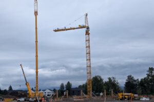 A tower crane pierces the skyline at the Hyas Point construction site along the Washougal waterfront May 13. (Contributed by Central Bethany Construction)