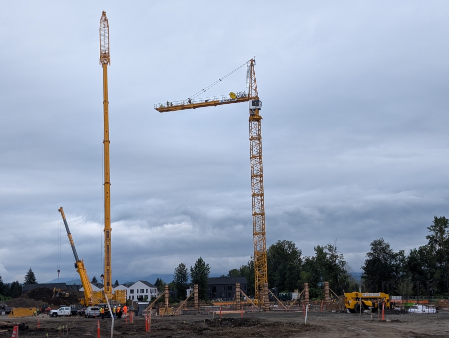 A tower crane pierces the skyline at the Hyas Point construction site along the Washougal waterfront May 13. (Contributed by Central Bethany Construction)