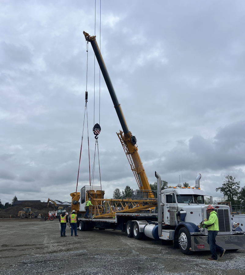 A construction crane arrives May 13 at the Hyas Point mixed-use development site near the Port of Camas-Washougal headquarters on the Washougal waterfront. (Contributed by Central Bethany Construction)