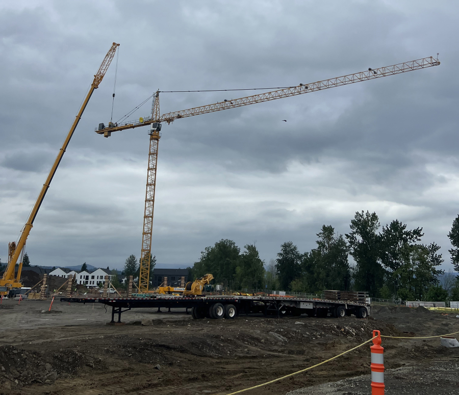 Construction crews install a tower crane at the Hyas Point construction site along the Washougal waterfront May 13. (Contributed by Central Bethany Construction)