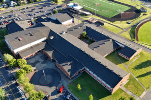 Constructed in the late 1990s, the roof on top of Washougal High School has deteriorated to the point that it is leaking and causing water damage inside the school building. The Washougal School District plans to replace the roof this summer. (Photo contributed by Garland Industries)