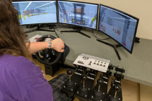 Washougal High School student Jacob Dillie uses the school’s new forklift simulator during a class session on Thursday, May 22, 2025. (Contributed by the Washougal School District)