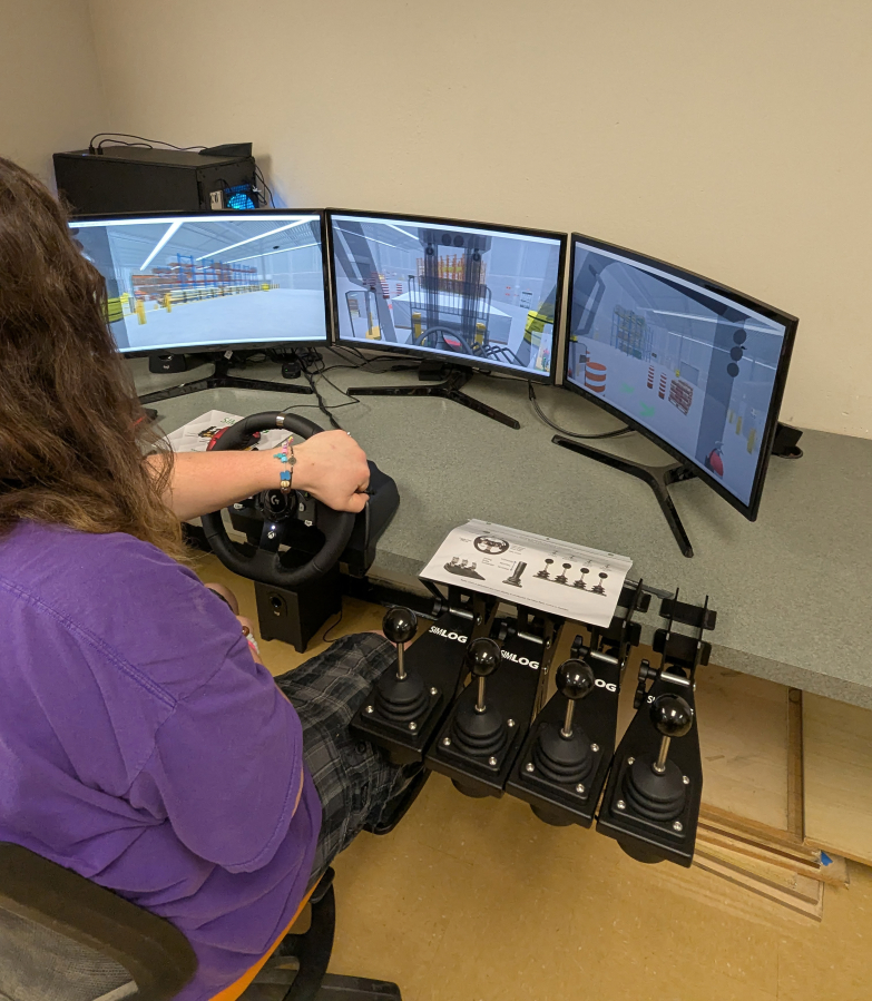 Washougal High School student Jacob Dillie uses the school&rsquo;s new forklift simulator during a class session on Thursday, May 22, 2025. (Contributed by the Washougal School District)