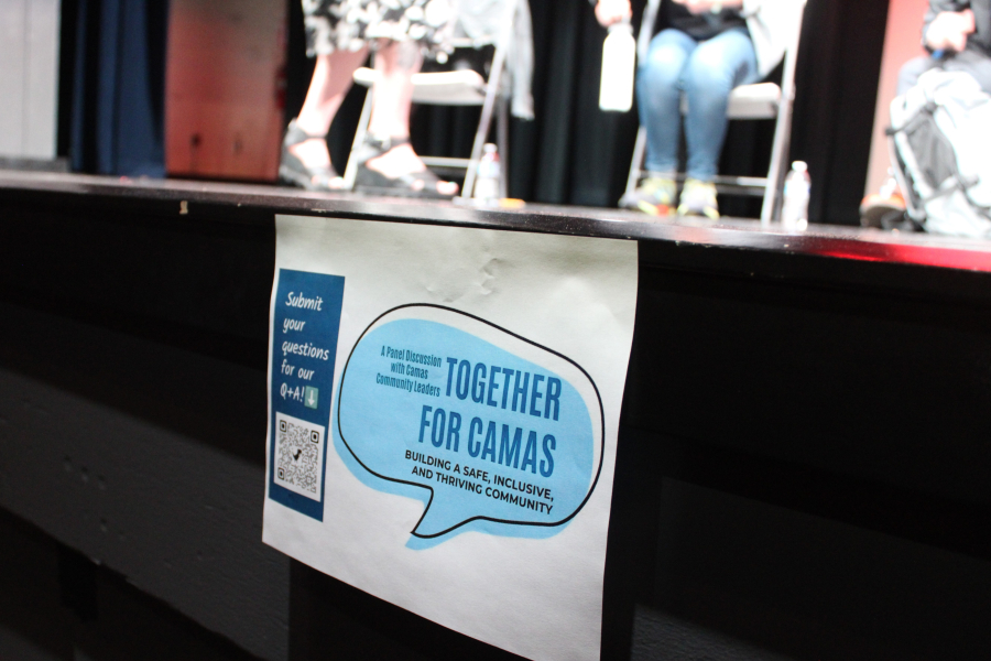 A “Together For Camas” sign hangs on the Joyce Garver Theater stage in Camas on Tuesday, May 20, 2025. (Kelly Moyer/Post-Record)