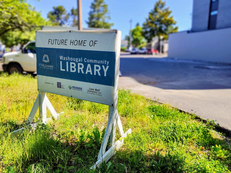 A sign sits in front of the future Washougal library site in downtown Washougal on May 27, 2025. (Doug Flanagan/Post-Record)