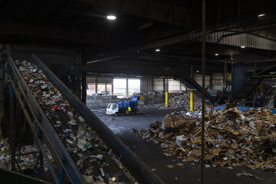 Different types of recycling are sorted as employees work at West Van Material Recovery Center on Nov. 13, 2023. Senate Bill 5284, passed by the Washington Legislature this session, creates a statewide plan for recycling. (Amanda Cowan/The Columbian files)