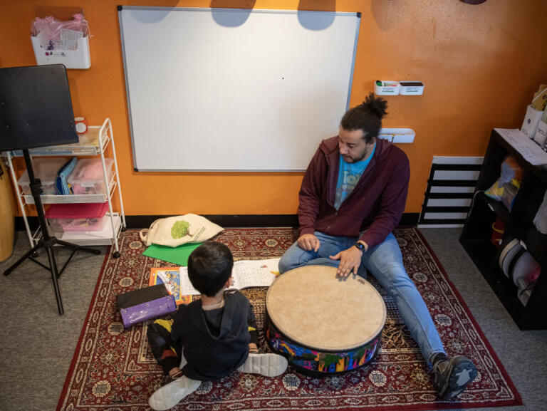 Instructor Brandon Dickson, right, teaches a drumming lesson April 23, 2025, at Opus School of the Arts in Camas.