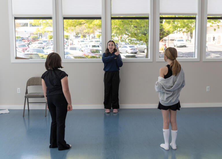 Instructor Cherish Hales, center, leads an acting lesson with students AJ Resnick, left, and Victoria Ivanov during class Wednesday, April 23, 2025, at Opus School of the Arts in Camas. The Camas business opened as a music school in 2015 and has recently expanded into an adjacent building, pictured, that offers room for theater and dance classes.