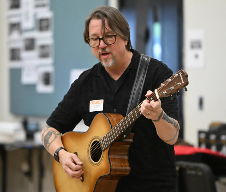 Christopher Corbell plays guitar May 6 at Washougal High School.