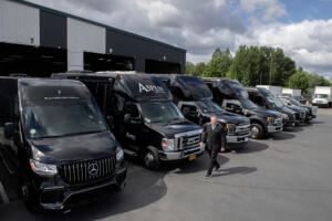 David Williams of Aspen Limo Tours walks past the fleet of vehicles he parks in Portland on Tuesday morning, May 20, 2025. Local businesses are bracing for increasing gas taxes as gas prices are also poised to rise in time for summer travel. (Amanda Cowan/The Columbian)