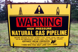 Warning signs are attached to fences all around the Williams natural gas pipeline pumping station north of Washougal, just off Brown Road. The company is planning maintenance work to a portion of the pipeline north of Camas. (The Columbian Files)
