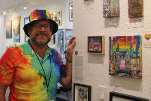 Portland artist Chuck Bloom stands near his artwork inside Gallery 408 in downtown Camas on Friday, June 6, 2025. Bloom is one of several Gallery 408 artists who have donated artwork to benefit a fundraiser for Cascade AIDS Project, the largest community-based HIV services provider in Southwest Washington and Oregon.