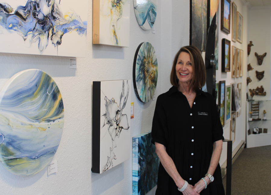 Brush Prairie artist Joanne Cavallaro stands near her artwork inside Gallery 408 in Camas on Friday. Cavallaro co-owns the 1-year-old downtown Camas gallery with Portland artists Kim Nickens and Michelle Purvis. (Kelly Moyer/Post-Record)