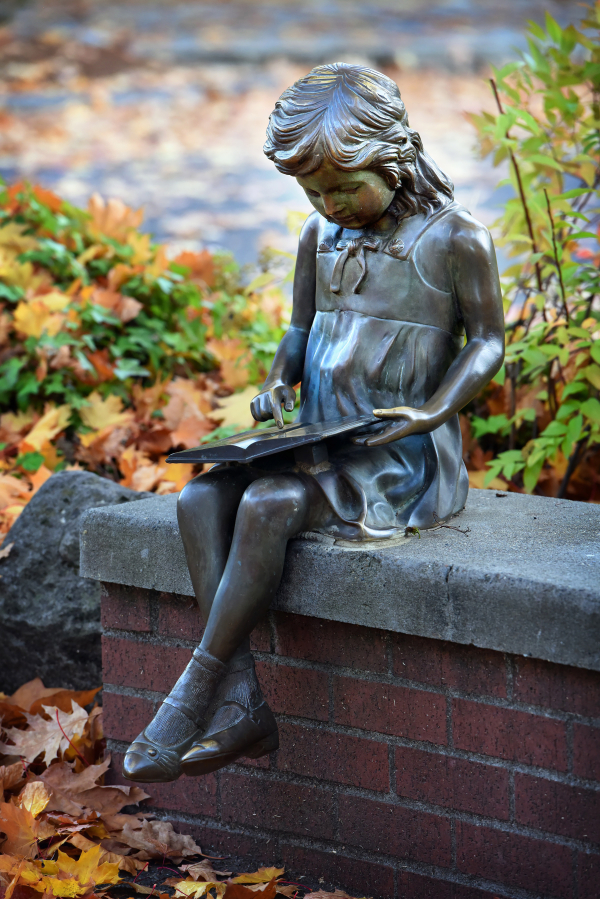 The Little Bronze Girl statue was stolen from its customary perch in downtown Camas on May 28 or May 29, according to the Camas Police Department. (Contributed by the Downtown Camas Association)