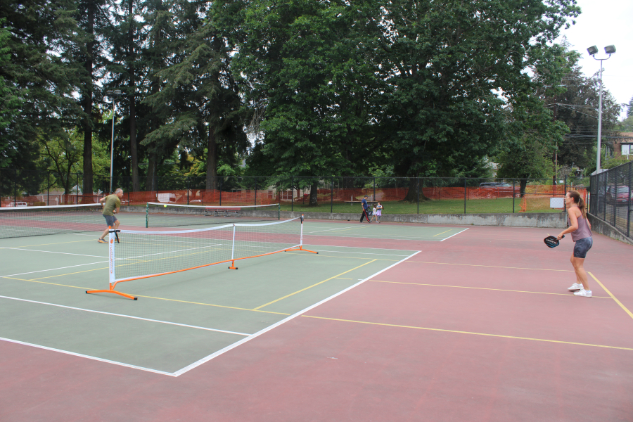 Camas residents Dawn, right, and John Hendricks, of Camas, play pickleball on a pickleball-tennis court at Crown Park in Camas on Aug. 12, 2024. (Kelly Moyer/Post-Record files)