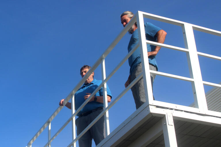 Port of Camas-Washougal Commissioners Larry Keister, left, and John Spencer take in the view from the rooftop deck of the port&rsquo;s new boathouse at Parker&rsquo;s Landing Marina on June 6.