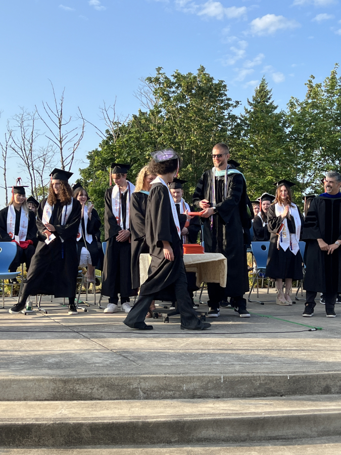 Discovery High School graduates receive their high school diplomas during the project-based learning school’s commencement ceremony in Camas on Thursday, June 12, 2025. (Courtesy of Doreen McKercher, Camas School District)