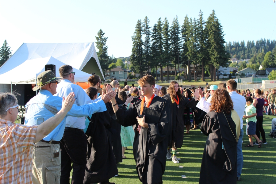 Washougal High School staff greet graduating seniors from the class of 2025 during the school’s graduation ceremony at Fishback Stadium in Washougal on June 14, 2025. (Courtesy of Washougal School District)