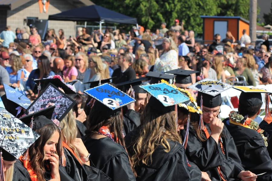 Class of 2025 graduating seniors from Washougal High School wear decorated caps during school’s commencement ceremony at Fishback Stadium in Washougal on Saturday. (Courtesy of Washougal School District)