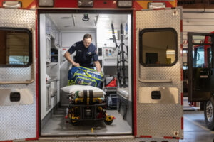 Firefighter-paramedic Nate Barmore checks equipment inside an ambulance March 21 at the Camas-Washougal Fire Department’s Station 42 in Camas. (Taylor Balkom/The Columbian files)
