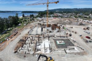 A construction crane arrives at the Hyas Point development construction site June 6 in Washougal. (Courtesy of RKm Development)