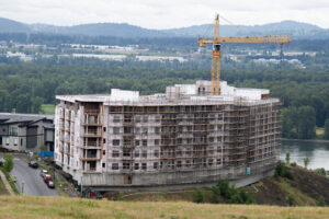 Work is continuing on Kirkland Development’s Ledges at Palisades project in east Vancouver, as seen May 12. The Vancouver-based developer expects the project to wrap up near the end of this year or early next year. (Amanda Cowan/The Columbian)